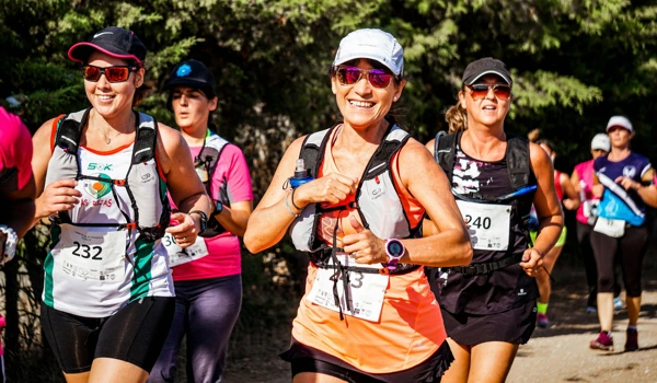 Group Of People Running In Race