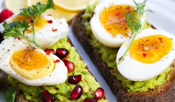 Close Up Of Eggs And Avocado On Toast