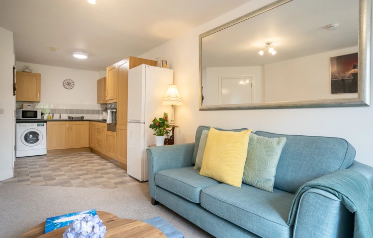 Kitchen lounge and sofa in apartment at Hampton House.