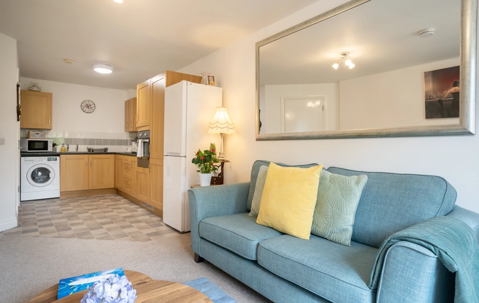 Kitchen lounge and sofa in apartment at Hampton House.