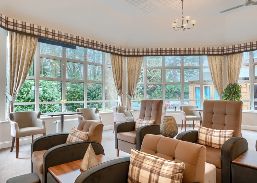 Residents cinema lounge at Westall House with lots of seating and modern windows.