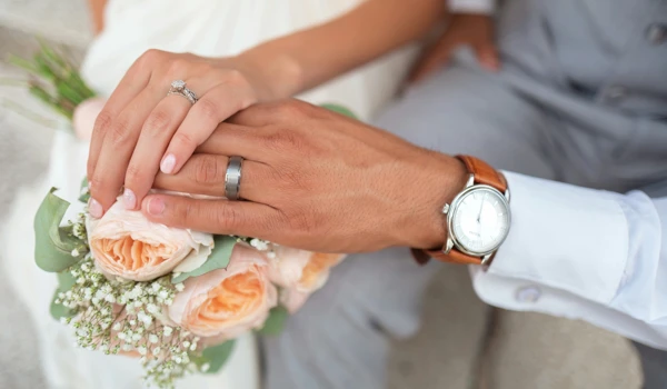 Close Up Of Hands Of Couple Getting Married