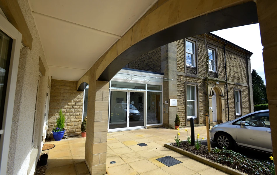 A view of the entrance under the archway at Woodlands