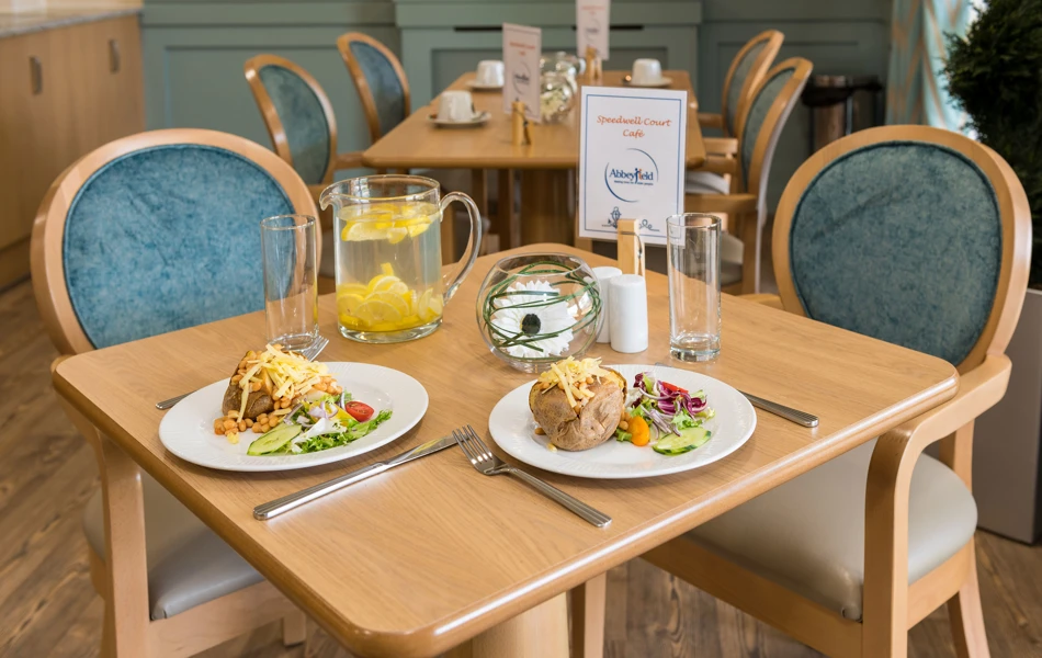 Table and chairs in communal cafe at Speedwell Court