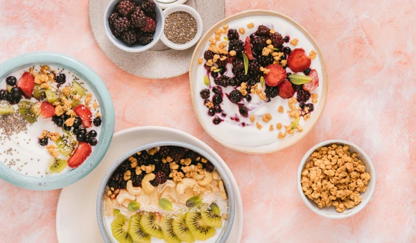 Selection Of Fruit Topped Yoghurts On A Table