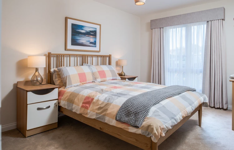 Residents large double bed with bed side tables and lamps at Hope Bank View, Sunderland