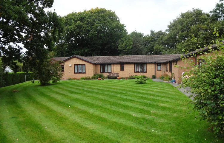 Large rear garden at Abbeyfield House, Stockport SK6 8DU