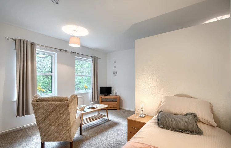 bedroom-and-lounge-area-at Abbeyfield House, Cockermouth CA13 9RH