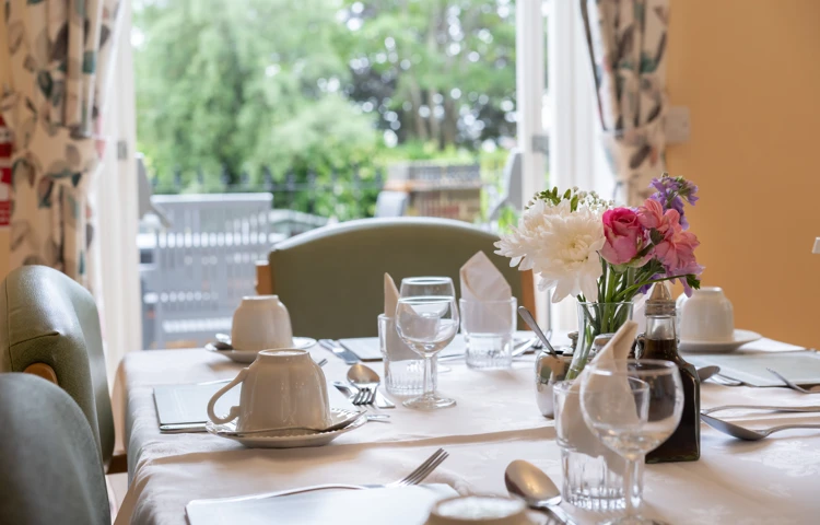 Dining room table with cutlery at Lee House in Wimbledon