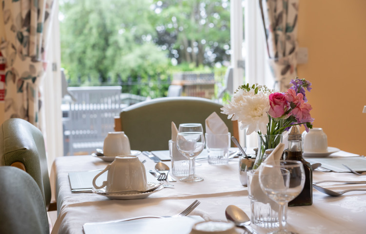 Dining room table with cutlery at Lee House in Wimbledon