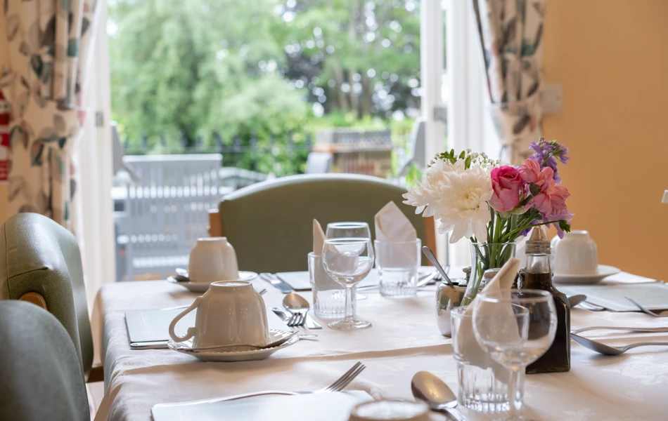 Dining room table with cutlery at Lee House in Wimbledon
