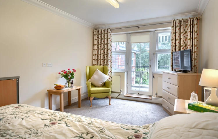 Lee House residents single bedroom with furniture