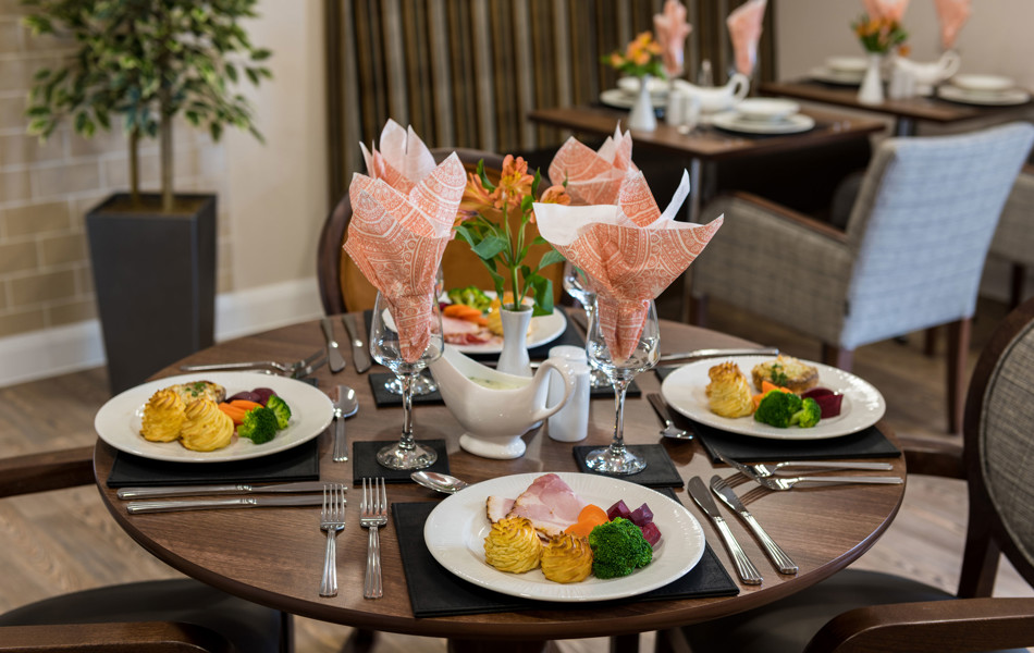 Four dinners around a table in the dining room