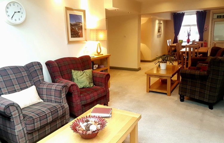 Bright lounge with tables and armchairs