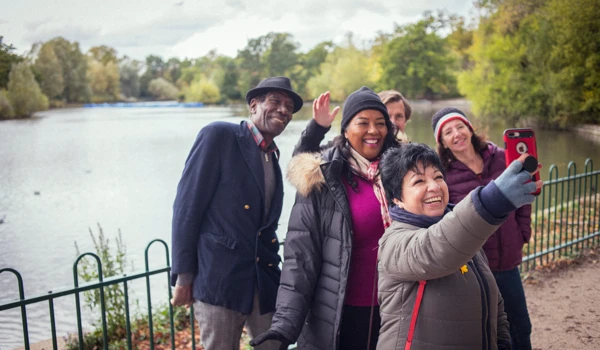 Group Of Older People Taking A Selfie In The Park Together