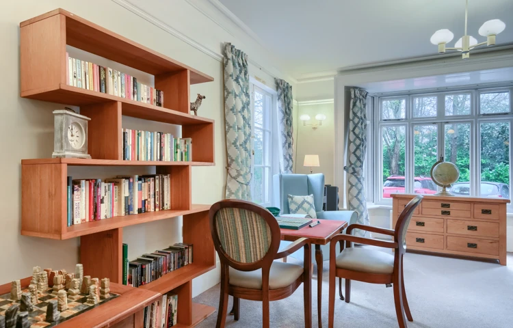Communal space at Westall House Residential Care Home in Horsted Keynes, designed for residents to socialise and enjoy reading, games, and other activities.
