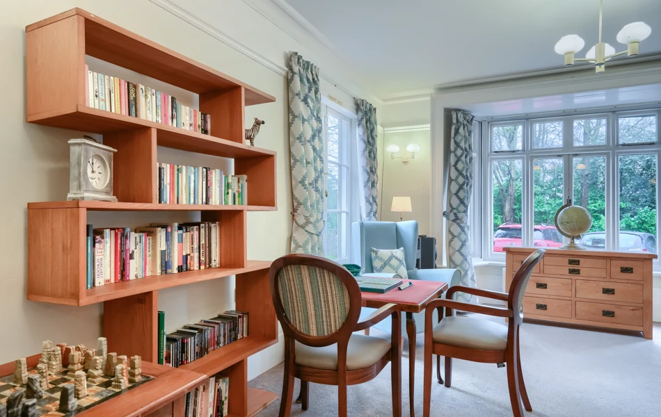Communal space at Westall House Residential Care Home in Horsted Keynes, designed for residents to socialise and enjoy reading, games, and other activities.