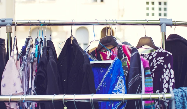 Rail Of Coats Hanging At A Jumble Sale