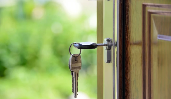 Up Close Image Of Key In Door