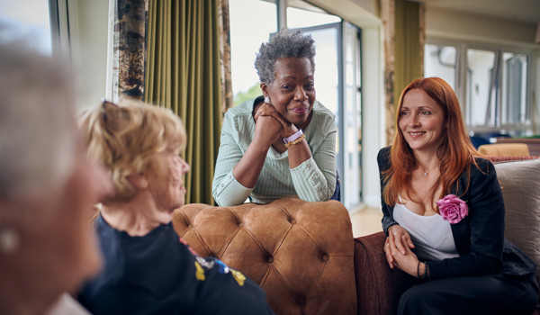 Group Of Women Sitting Together In Lounge