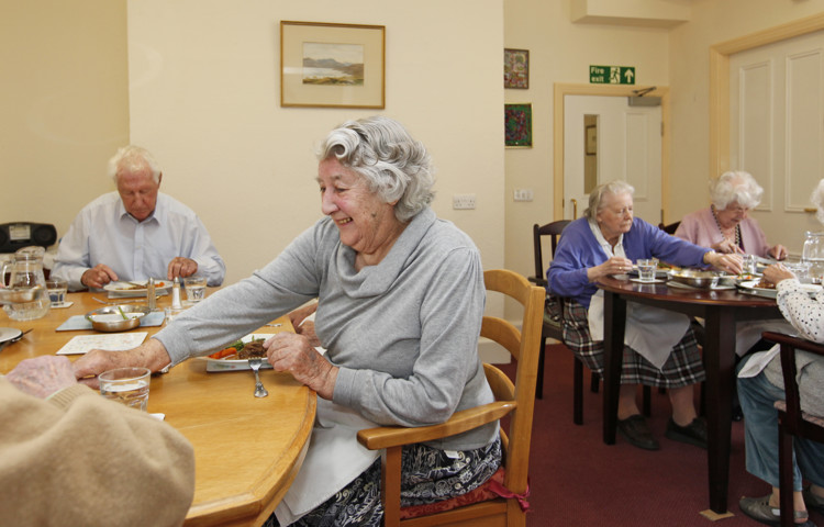 Residents sat in the dining room enjoying a meal